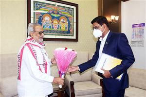 Dr S Mohanty, Chairman,  presenting the Annual Report to Hon’ble Governor, Odisha